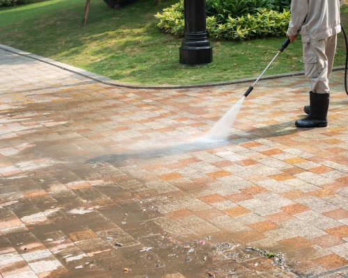 Outdoor floor cleaning with a pressure water jet on street